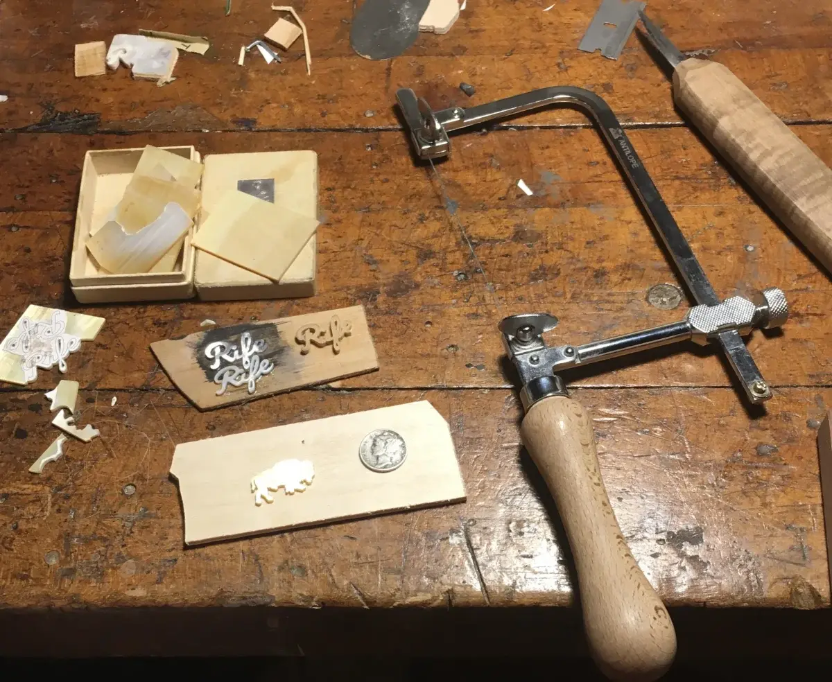 Hand-cutting mother-of-pearl pieces for headstock inlay with precision tools