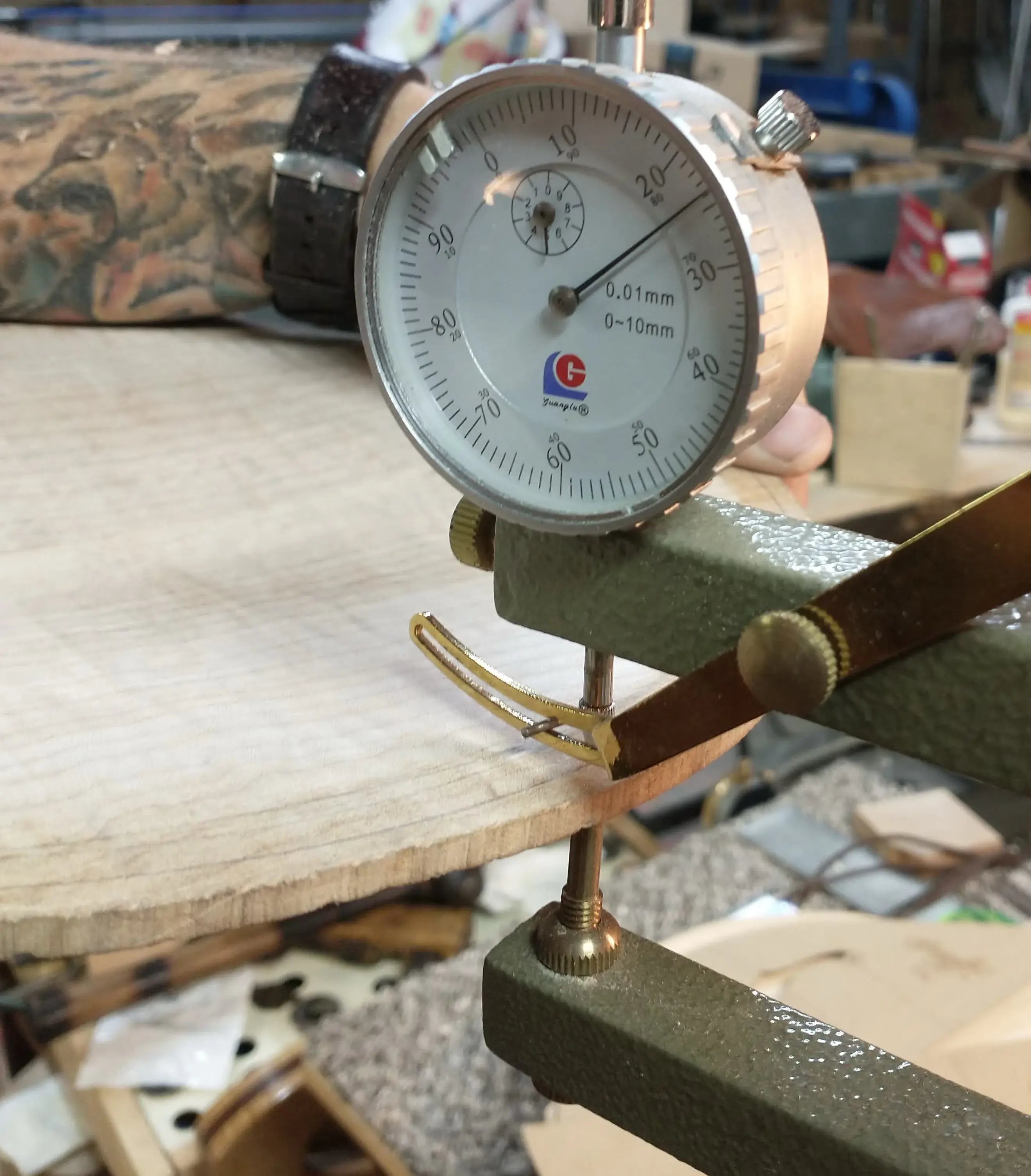 Dial indicator measuring plate thickness