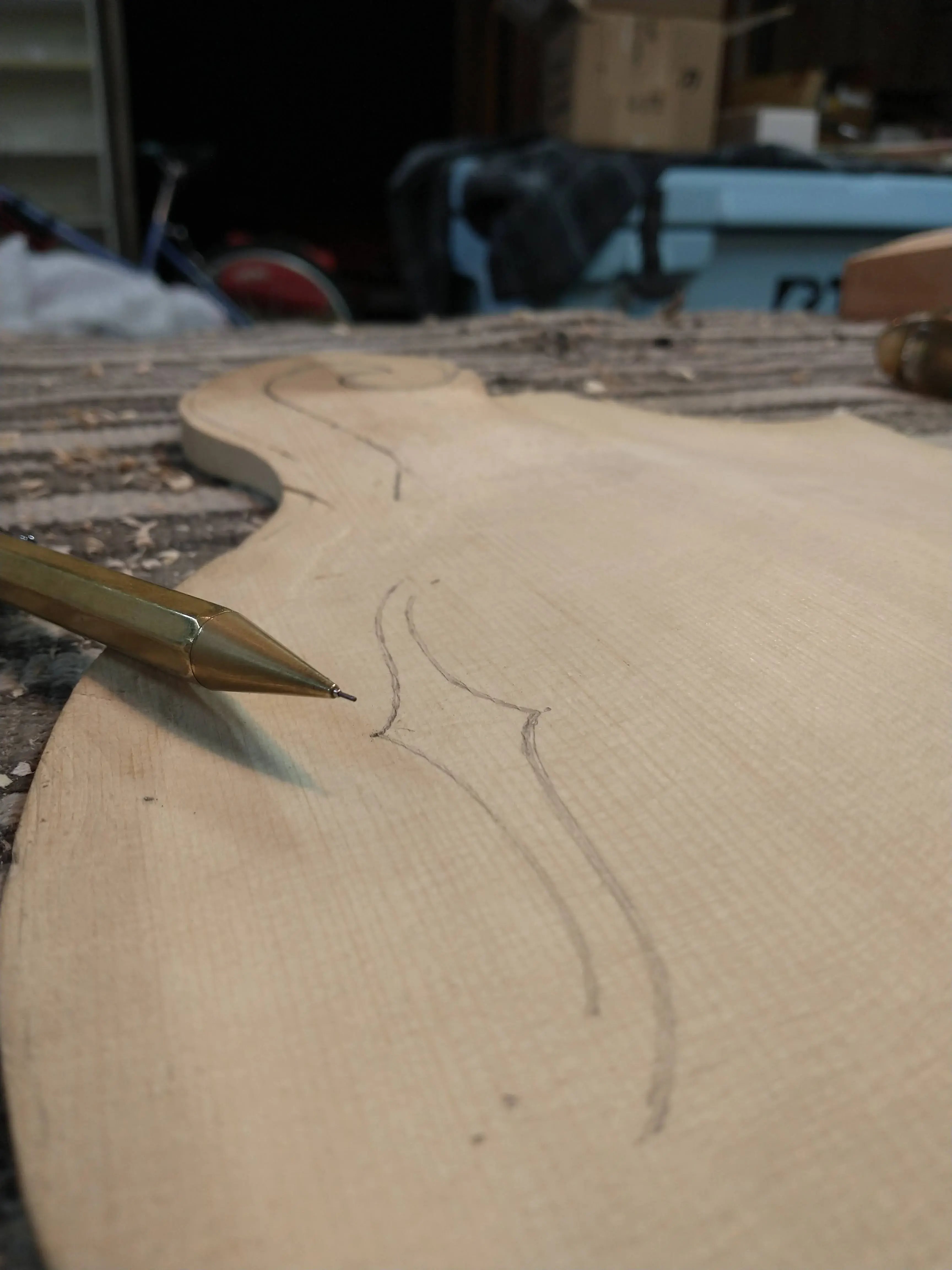 Marked f-hole layout on a mandolin top