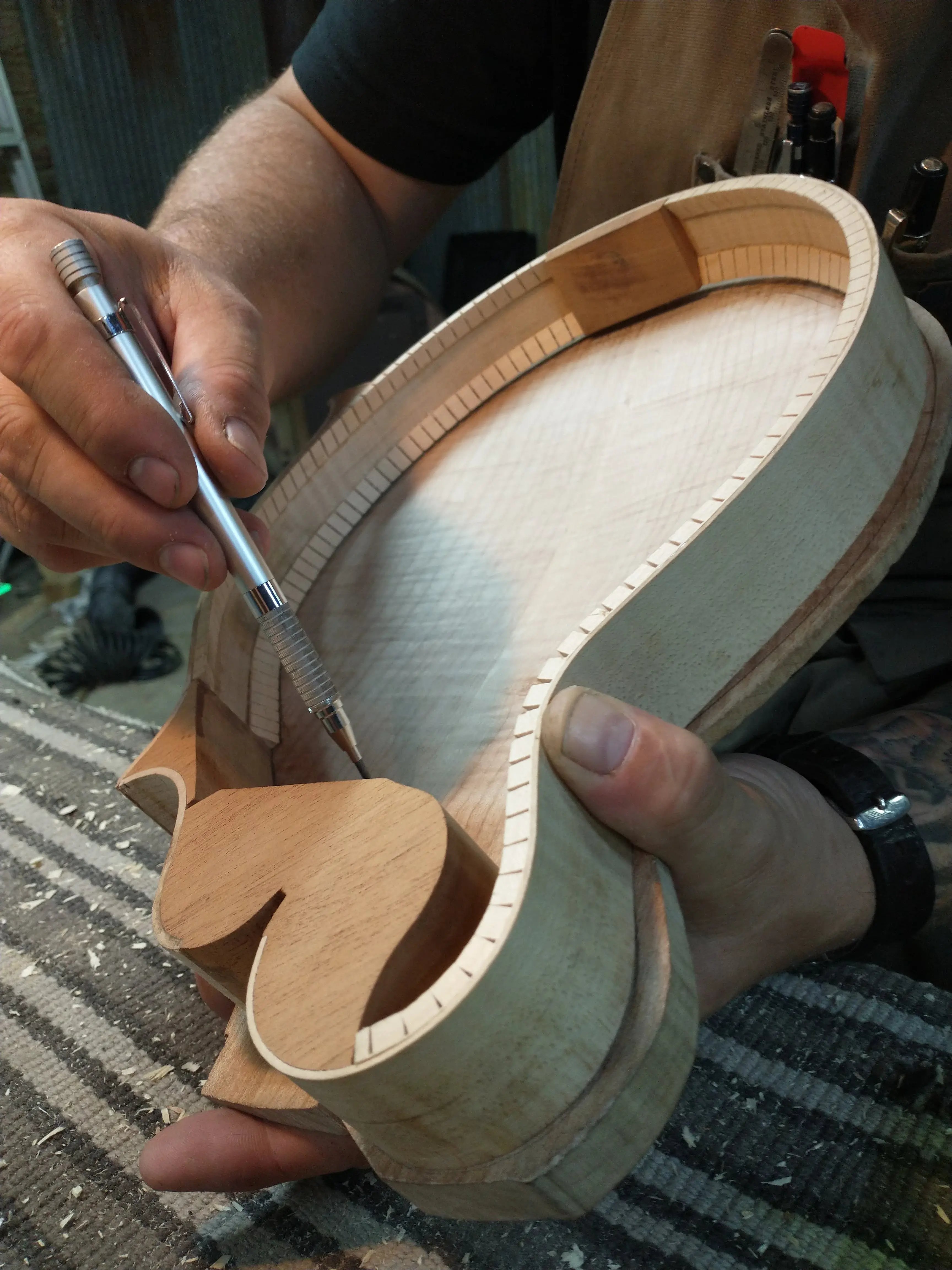 Final measurements taken on a mandolin assembly