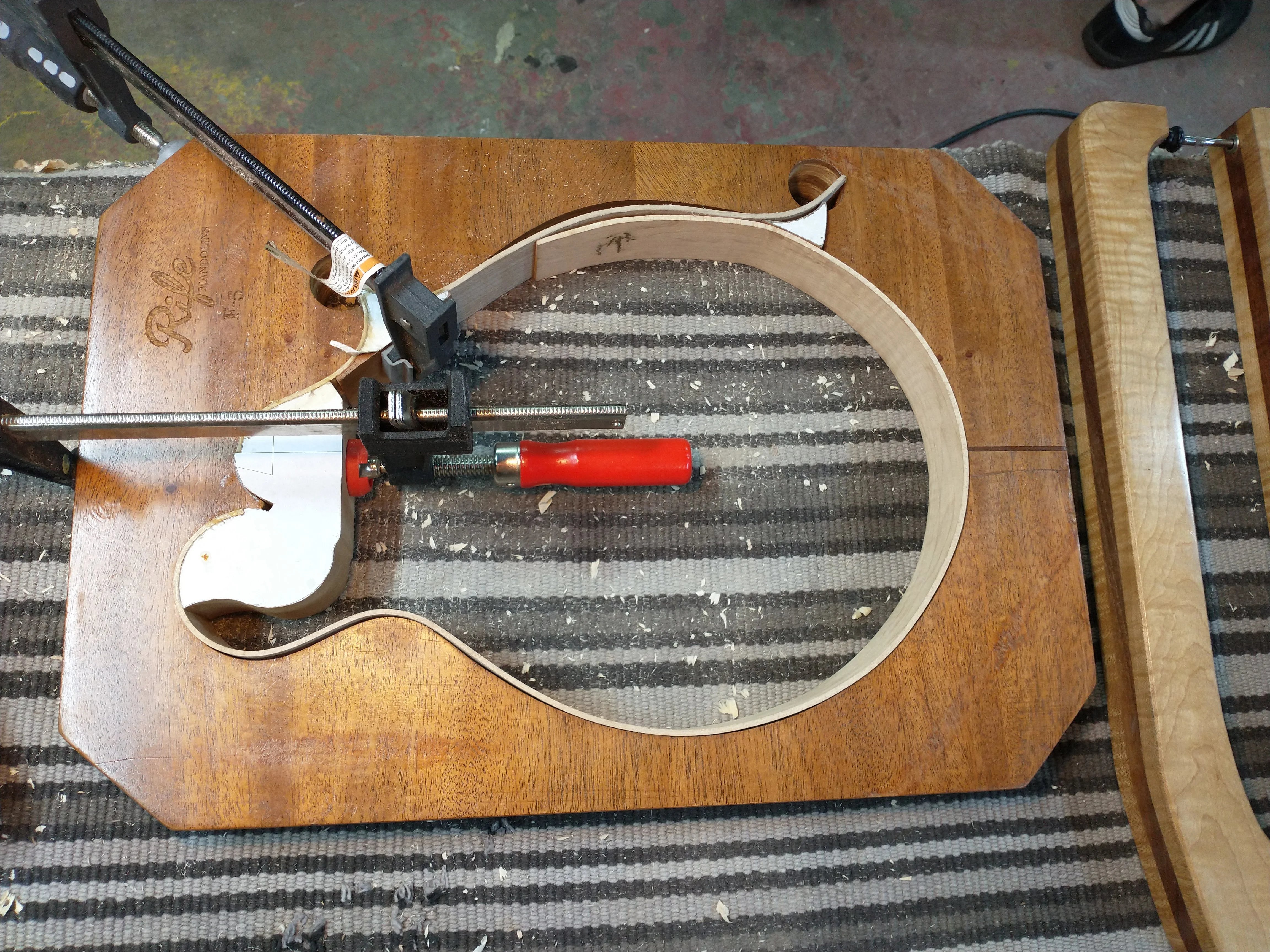 Mandolin plates clamped to the rim during glue-up